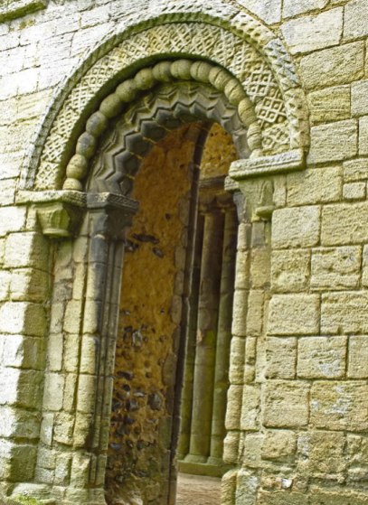 the richly carved doorway on the west front of the church